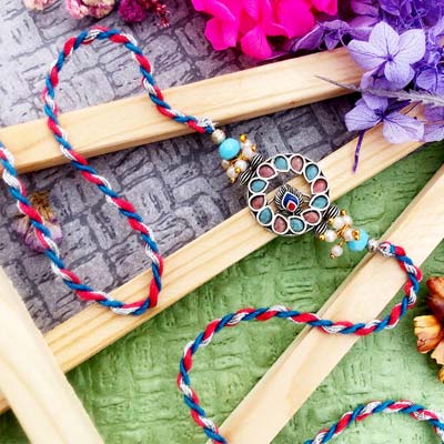 Designer brass thread Rakhi for brother