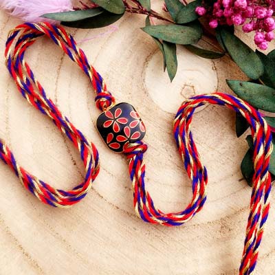 Simple flower printed red blue thread Rakhi