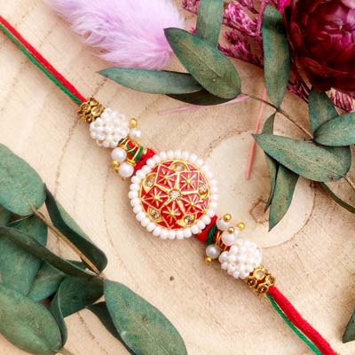 Authentic designer Rakhi with white beads and thread