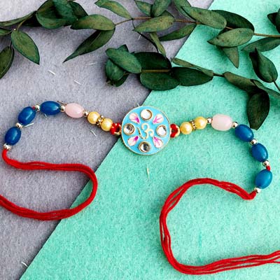 Om symbol red thread pearl Rakhi