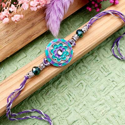 Attractive blue flower design thread Rakhi