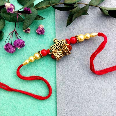 Golden Rudraksha Rakhi with Red Beads