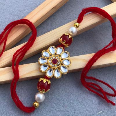 Elegant Kundan Designer Rakhi with Red Beads & Pearls
