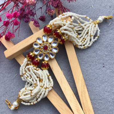 Elegant Kundan Flower & Pearl Bracelet Rakhi - A Timeless Symbol of Love