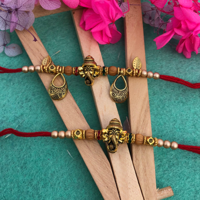 Auspicious Ganesha Bhaiya Bhabhi Rakhi Set - Antique Gold Plated Rakhi for Brother & Bhabhi
