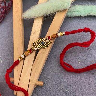 Elegant Peacock Feather Rakhi for Brother | Traditional Thread Rakhi with Beads & Pearl