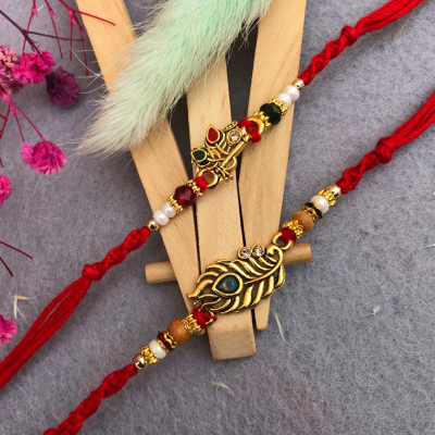 Elegant Peacock Feather & Flute Rakhi Set for Brothers - Set of 2