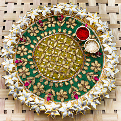 Awesome crafted Rakhi Thali with a silver flower design