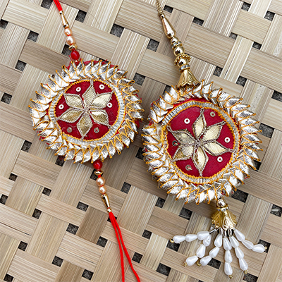 Awesome silver flower with mehroom color thread rakhi