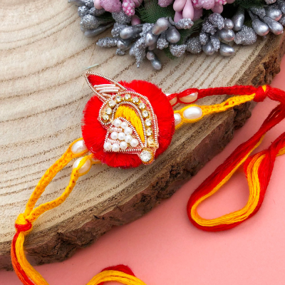 designer piece of red base thread Rakhi for brother