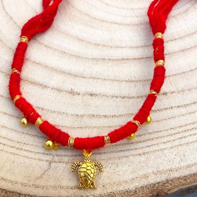 authentic Red Thread Rakhi with tortoise design