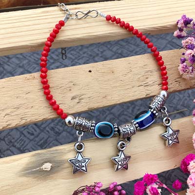 Simple red bracelet Rakhi for girls