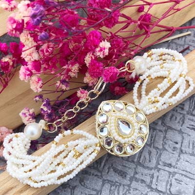 Jewellery design stone, pearl bracelet Rakhi for Bhabhi