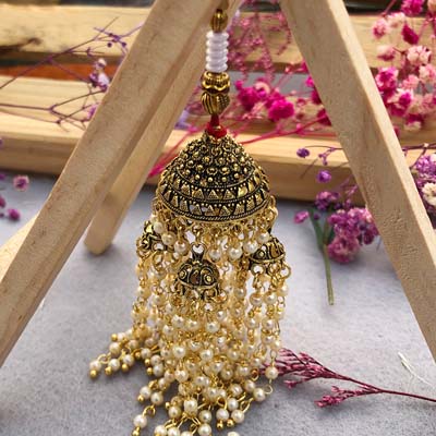 Auspicious brass Lumba Rakhi for bhabhi