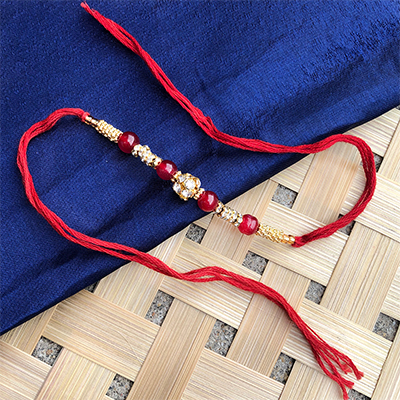 Golden beads Red pearl classy Dora Rakhi for bhaiya bhabhi