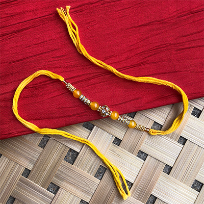 Trending Orange pearl yellow Dora Rakhi for brother