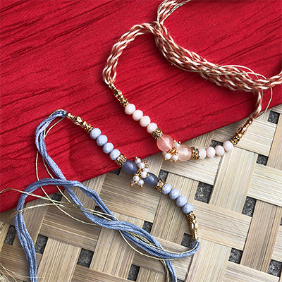 Lovely Grey, peach Beads, pearl, dora Rakhi combo