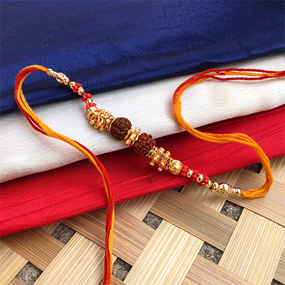 Auspicious two rudraksh golden pearl dora rakhi for brothers