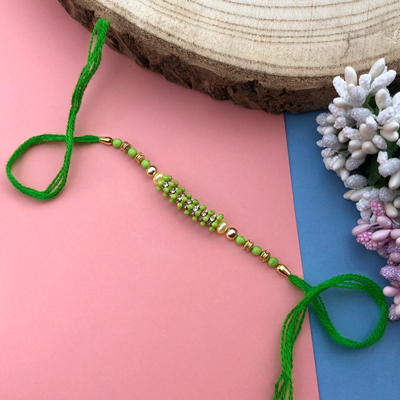 Green pearl woolen thread Dora Rakhi for bhaiya bhabhi