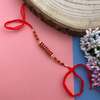 Traditional Red pearl, woolen Dora Rakhi for bhaiya & bhabhi
