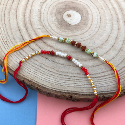 Red & white pearl and Rudrakash Dora Rakhi combo of 2