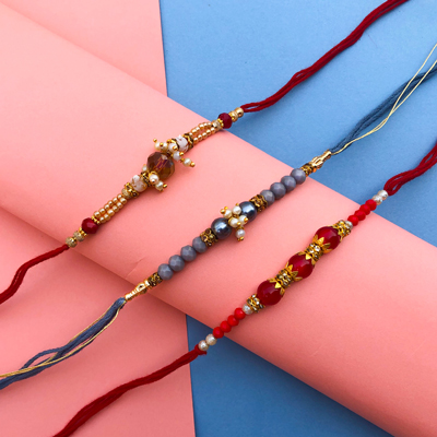 A combo of 3 beautiful grey, red, mahroom Dora Rakhi