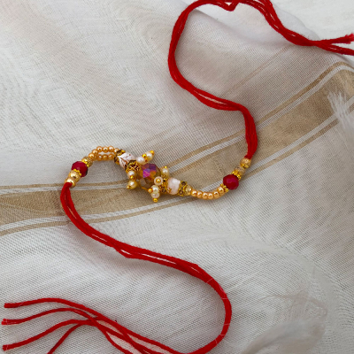 beautiful Red Dora Rakhi for bhaiya, bhabhi