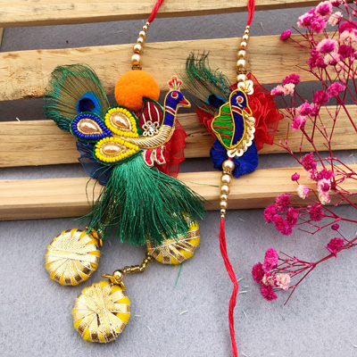 Vibrant Peacock Bhaiya Bhabhi Rakhi Set with Floral Accents