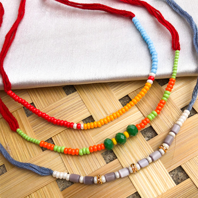 Beautiful Set Of 3 pearl, beads & Red Beads Rakhis
