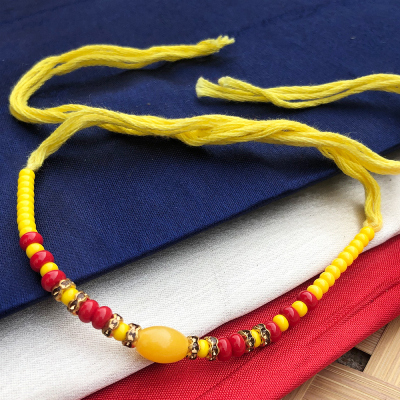 Beautiful Precious yellow beads with pearl bhaiya Rakhi