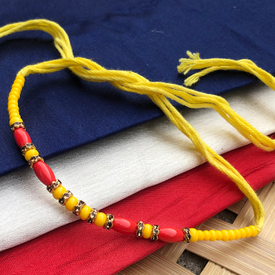 Beautiful yellow beads with pearl bhaiya Rakhi On Rakshabandhan