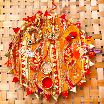 authentic puja thali with bhaiya bhabhi and 2 kids Rakhi combo