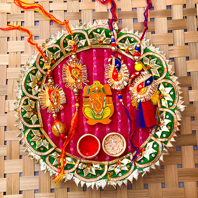 traditional puja thali with 2 pair of bhaiya bhabhi Rakhi combo