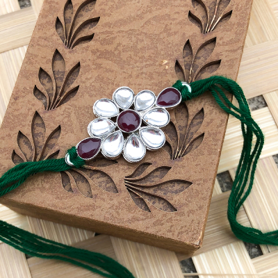 Beautiful Crystal Pearl floral Rakhi set for bhaiya with green thread