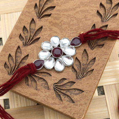 Beautiful Crystal Pearl floral Rakhi set for bhaiya with red thread
