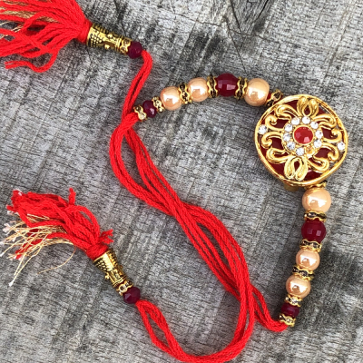 Exuberant Pearl & Red Stone Rakhi for Brothers