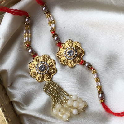 Eyecatching Golden Flower Precious Bhaiya Bhabhi Rakhi