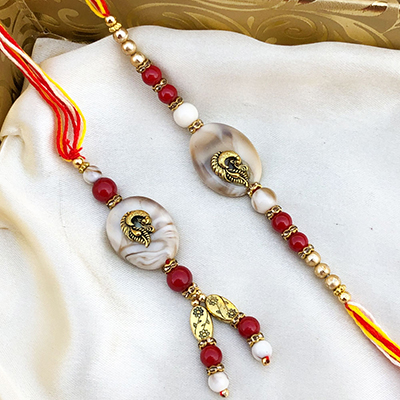 Graceful Rare White Stone Gold Work Rakhi for bhaiya Bhabhi