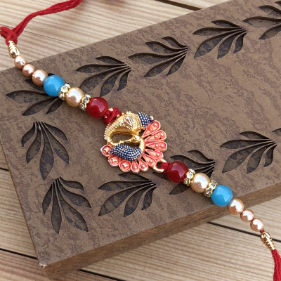 Alluring Multicolor Pearl Peacock Rakhi Set for Brother