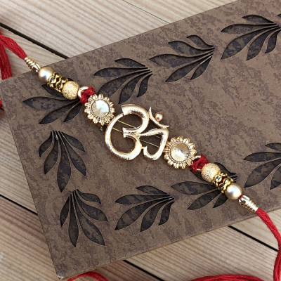 Delightful OM Design Gold Set of Rakhi for Raksha Bandhan