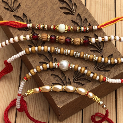 Ravishing White Marble & Pearl 5 Rakhi Combo Set