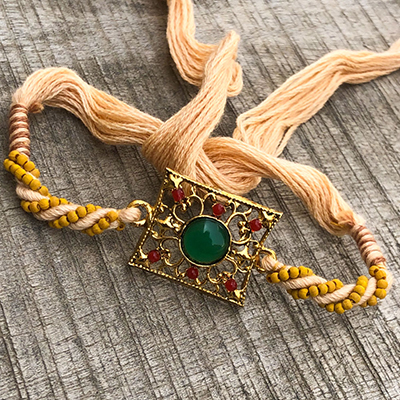 Magnificent Green Stone Gold Rakhi Thread for Bhaiya