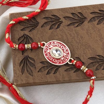 Fascinating Diamond & Gold Rakhi Set for Brother