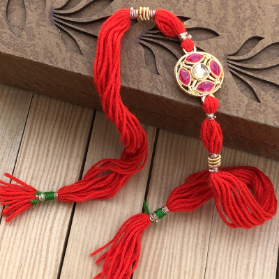 Durable Precious Stone Gold Rakhi for Brother