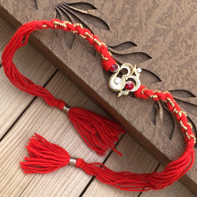 Vivacious Diamond Stone OM Rakhi Thread for Bhaiya