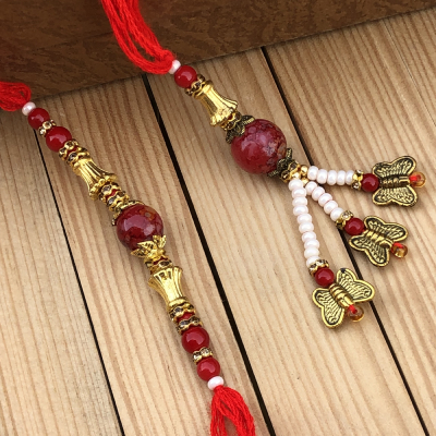 Blooming Rare Red Pearl & Beads Lumba Rakhi for Bhaiya Bhabhi