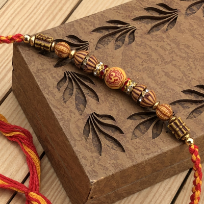 Majestic Wooden Beads OM Rakhi for Raksha Bandhan