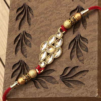 Marvelous Glass Diamond Gold Rakhi for Brother