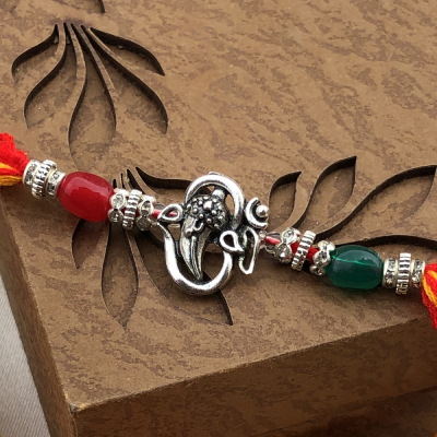 Delightful Om Sign Silver Rakhi Set for Brother