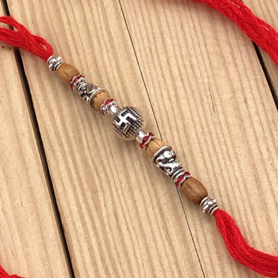 Exuberant Silver Swastik Rakhi for Raksha Bandhan